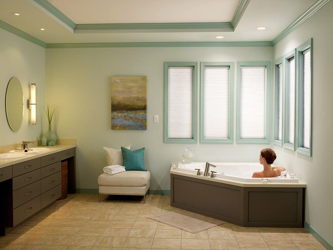 Woman in Tub with Fully Closed Light Filtering Honeycomb Shades