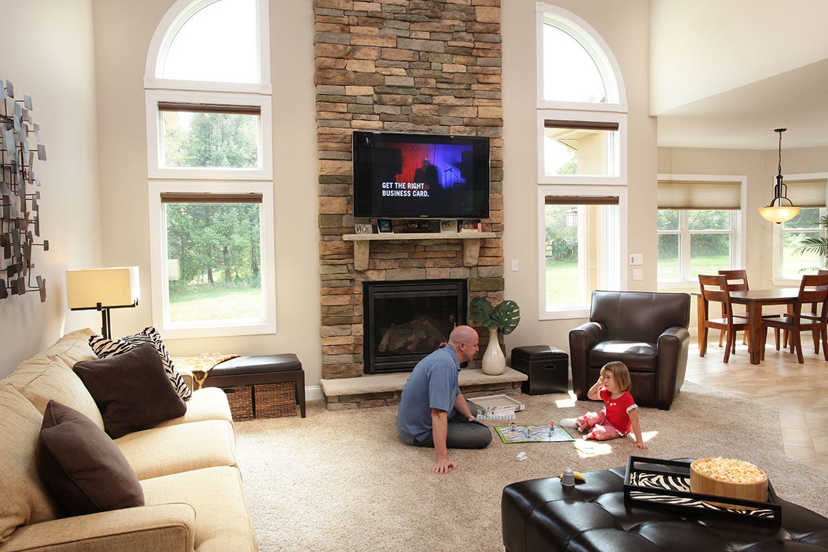 Man and child playing a board game in Living Room with Open Room Darkening Honeycomb Shades