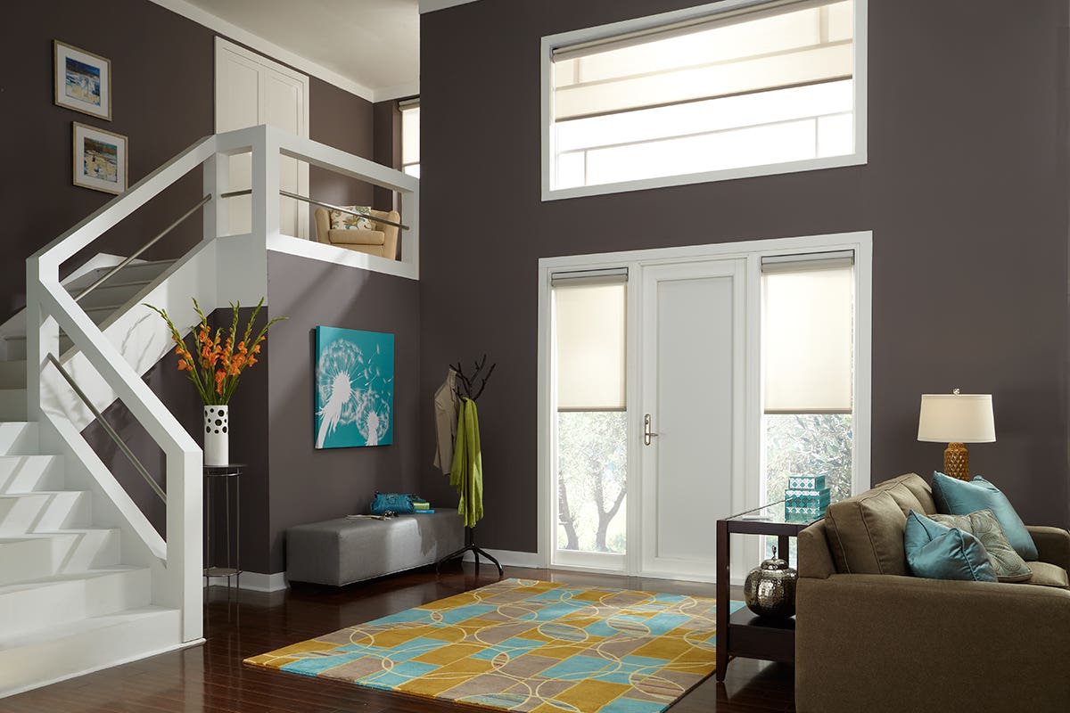 Empty Foyer with Partially Closed Translucent Roller Shades on Windows