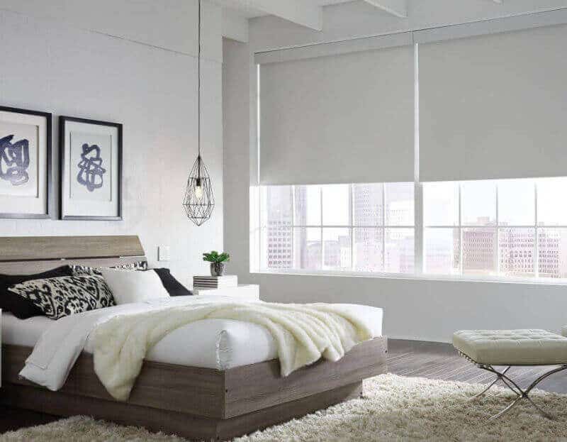 Light, well-lit bedroom with Serena Roller Shades