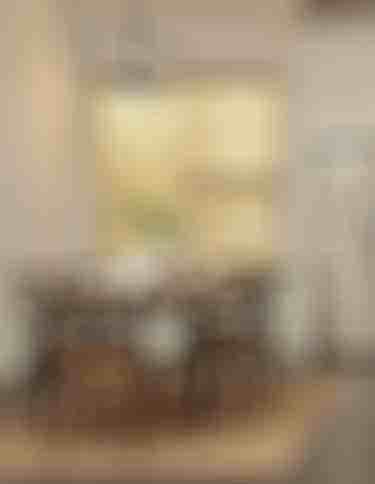 Kitchen table with six chairs around, stainless steel fridge against wall, and wood blinds partially open